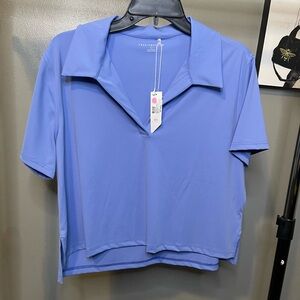 Travis Mathew Women’s Large Deco District Moveknit Polo NWT 89$